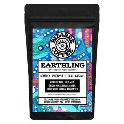 A bag of Earthling light-medium roast peaberry Bizarre Coffee. Tasting notes: complex, pineapple, floral and caramel.