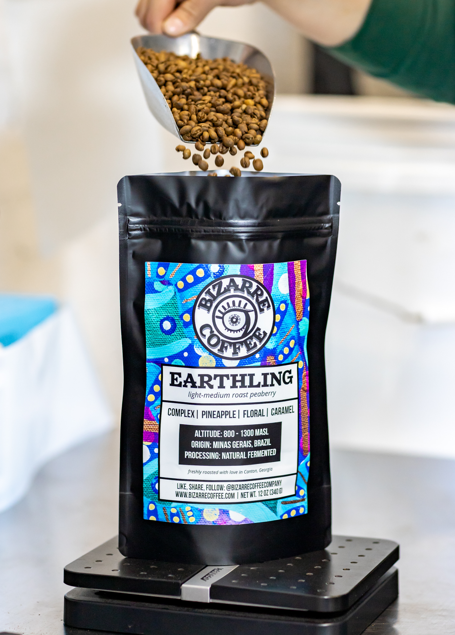 A bag of earthling coffee with coffee beans.